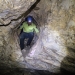 Caver with headlamp in Dennings Labyrinth, Wombeyan Karst Conservation Reserve