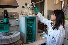Person working in lab with scientific instruments.