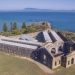Aerial view of Trial Bay Gaol, Arakoon National Park, with Administration Block and two wings shown.