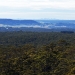 The view of the Sydney skyline over rugged bushland from the Powerline Trail in the Bargo State Conservation Area