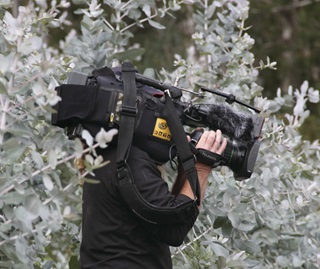 Camera person filming in Kosciuszko National Park