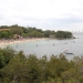 View from Shakespeares Point of a crowded Shark Beach, Sydney Harbour National Park, with Sydney city in the background
