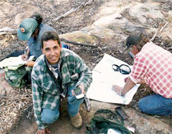 Allan Wheeler, Mark Cain and Kerry Ashby recording a grinding grooves site during Aboriginal site survey in Pilliga NR in April-May 2006