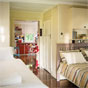 Partridge Cottage bedroom, Cape Byron State Conservation Area (Image: David Young/DECCW) Partridge Cottage bedroom, Cape Byron State Conservation Area (Image: David Young/DECCW)