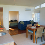 Kitchen and dining in the Lake front spa villa at Myall Shores Resort, Myall Lakes National Park (Image: Michael van Ewijk/DECCW) Kitchen and dining in the Lake front spa villa at Myall Shores Resort, Myall Lakes National Park (Image: Michael van Ewijk/DECCW)