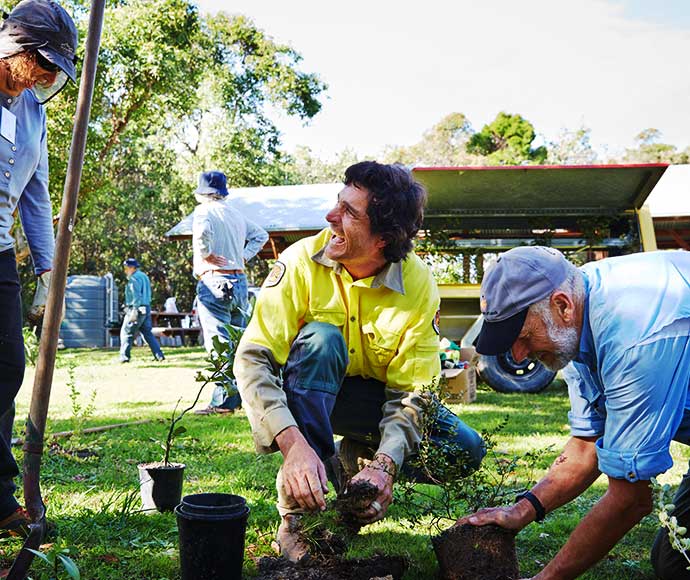 A ranger working with volunteers on a rehabilitation program in Yuraygir National Park