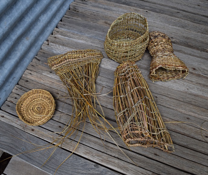 Baskets and fish traps woven from rushes and reeds using First Nations traditional weaving techniques