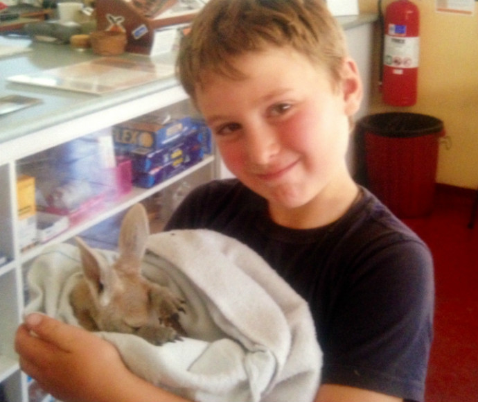 James Farrell holding a kangaroo joey