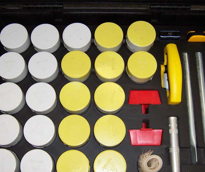 SoilWatch: soil sampling tubes for treatment and control sites indicated by different coloured lids
