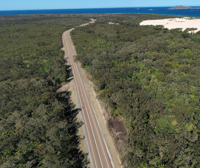 An aerial image of the new stretch of Mungo Brush Road, with the former part of Mungo Brush Road just visible on the right-hand side. The old road has now been rehabilitated.