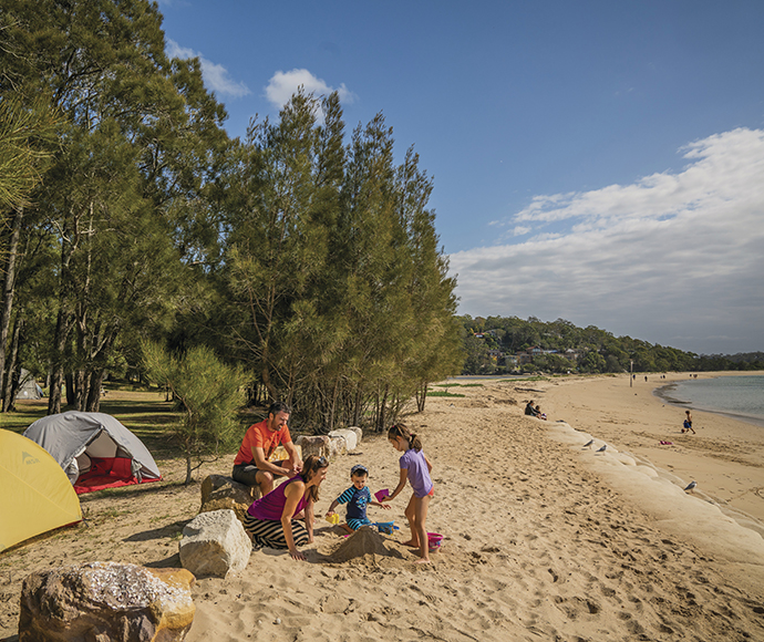 People on the beach near their campsite, Bonnie Vale campground, Royal National Park