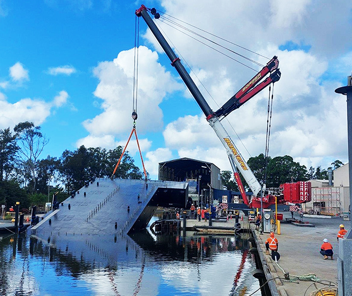 The Fort Denison pontoon is lifted into place at the dry dock to allow fit out to be completed