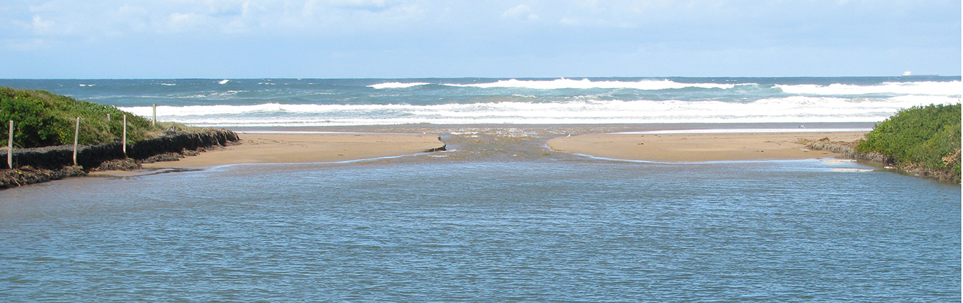 Towradgi Lagoon breaking out into the ocean and creating a natural estuary entrance after rainfall.