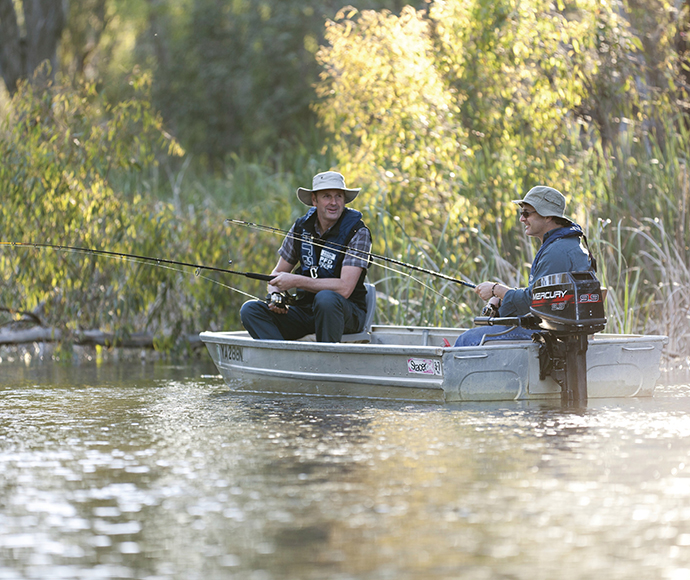 Two men fishing from a small boat, Gulpa Creek, Murray Valley National Park