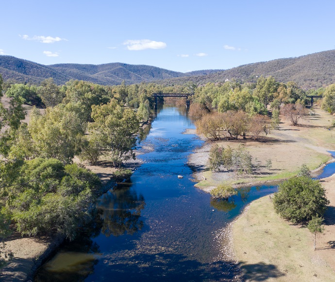 Looking down and along the tree-lined Gwydir River at Bingara, with mountains in the background