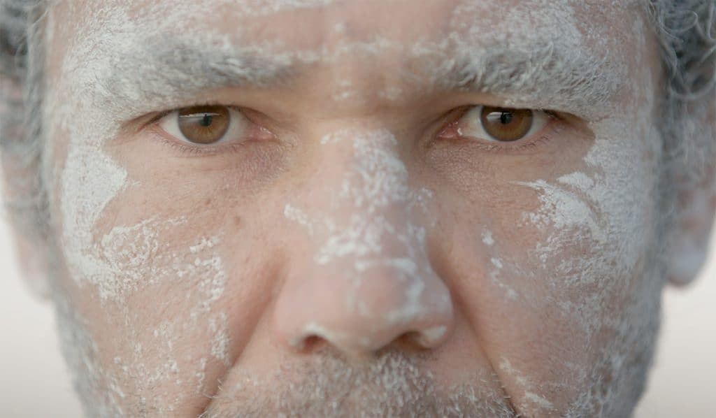 Close-up of Aboriginal man Nathan Brennan in paint