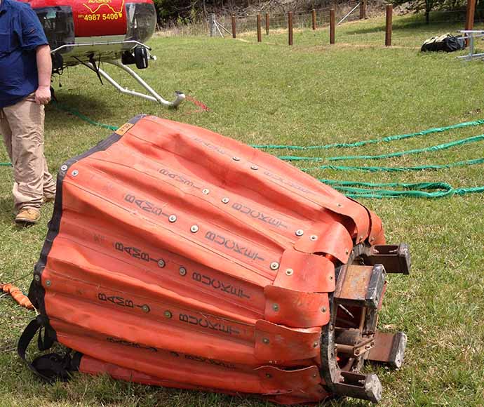 The bambi bucket is a large bright orange rubber bucket that can be collapsed down when empty