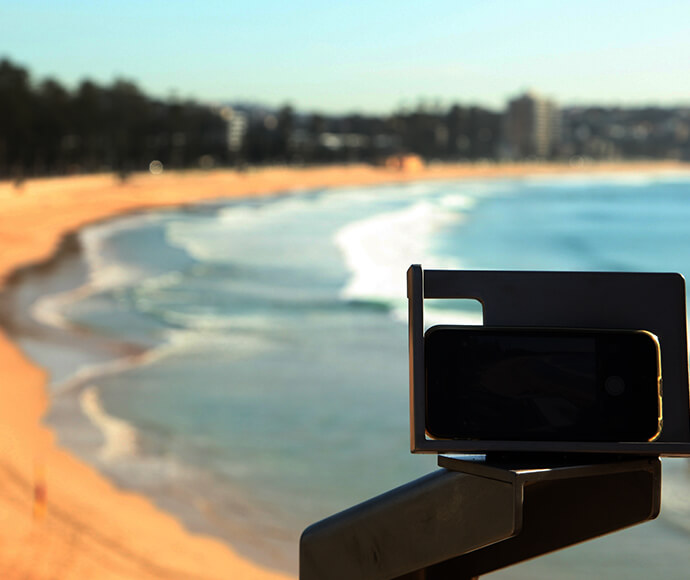 A CoastSnap camera mount looks over Manly Beach (South Steyne).