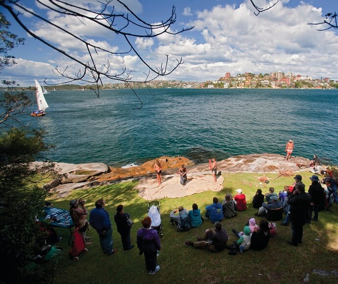 People enjoying an Aboriginal cultural experience, Sydney Harbour National Park.
