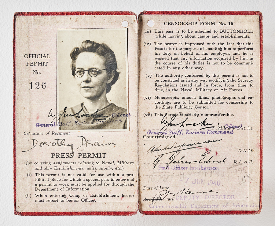 Press permit for Dorothy Drain that shows a black and white portrait photograph of her.