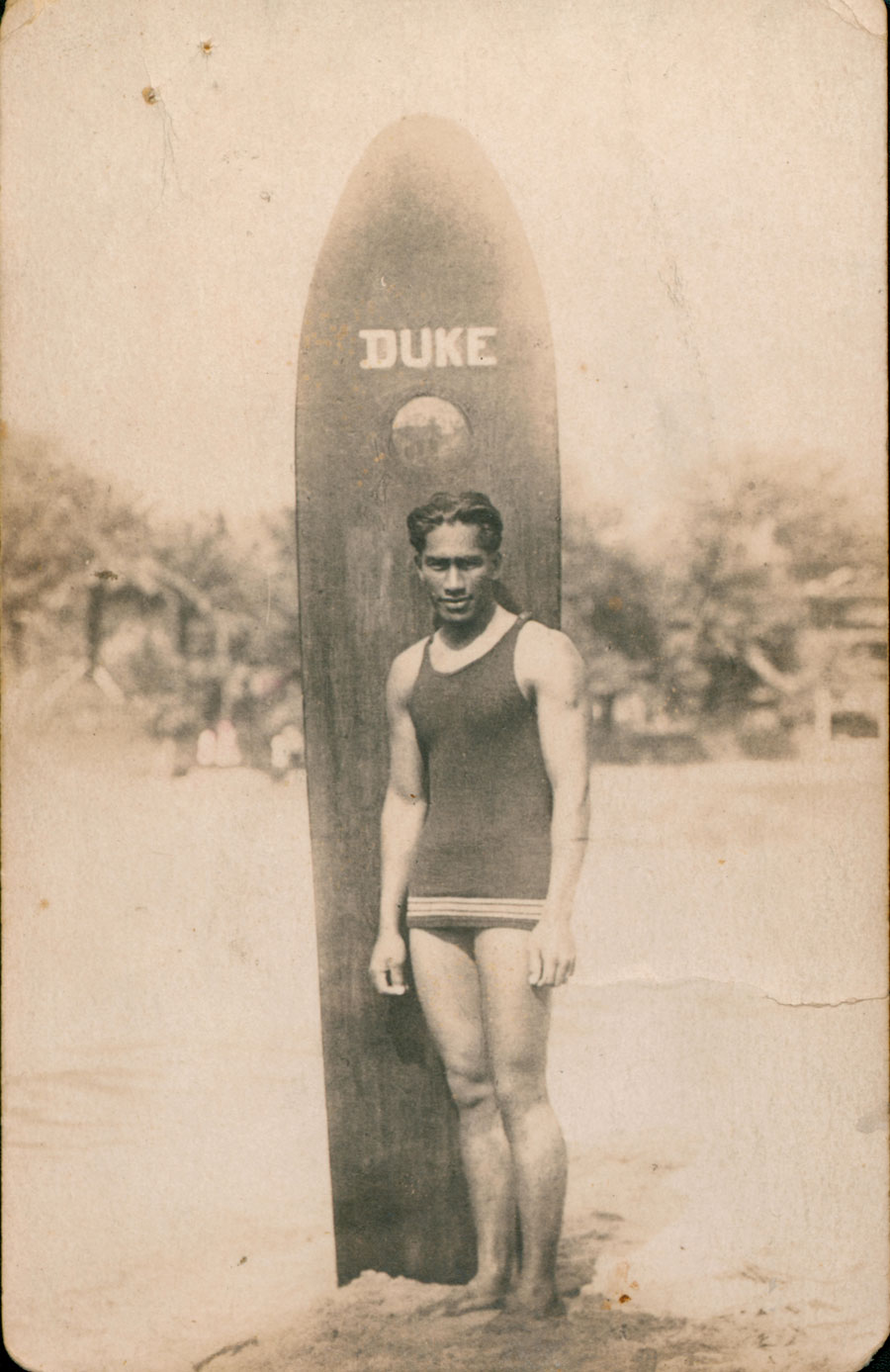 This sepia postcard depicts Hawaiian champion swimmer and surfer Duke Kahanamoku in about 1915. Duke gave a legendary demonstration of surfing techniques at Freshwater Beach on 24 December 1914.