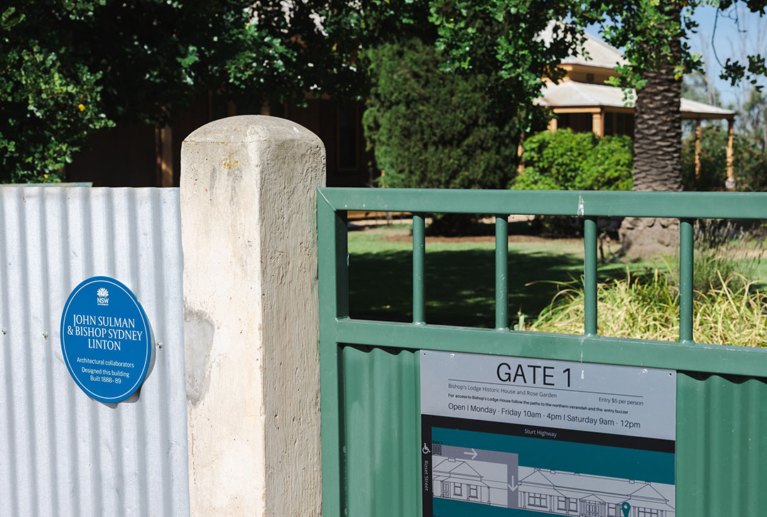 Fence with a blue plaque