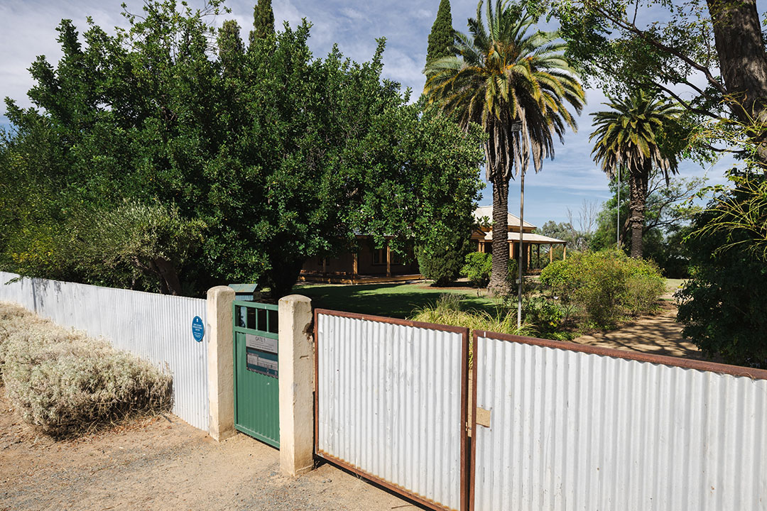 Fence with a blue plaque