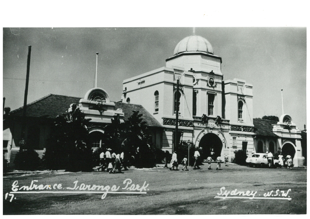 Black and White image of the front of a building. Text on the image reads 'Entrance Taronga Park.' 'Sydney. N.S.W.'