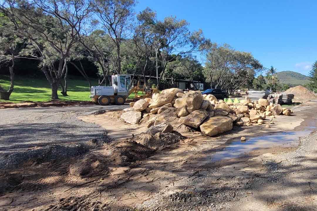 A pile of rubble beside a road.