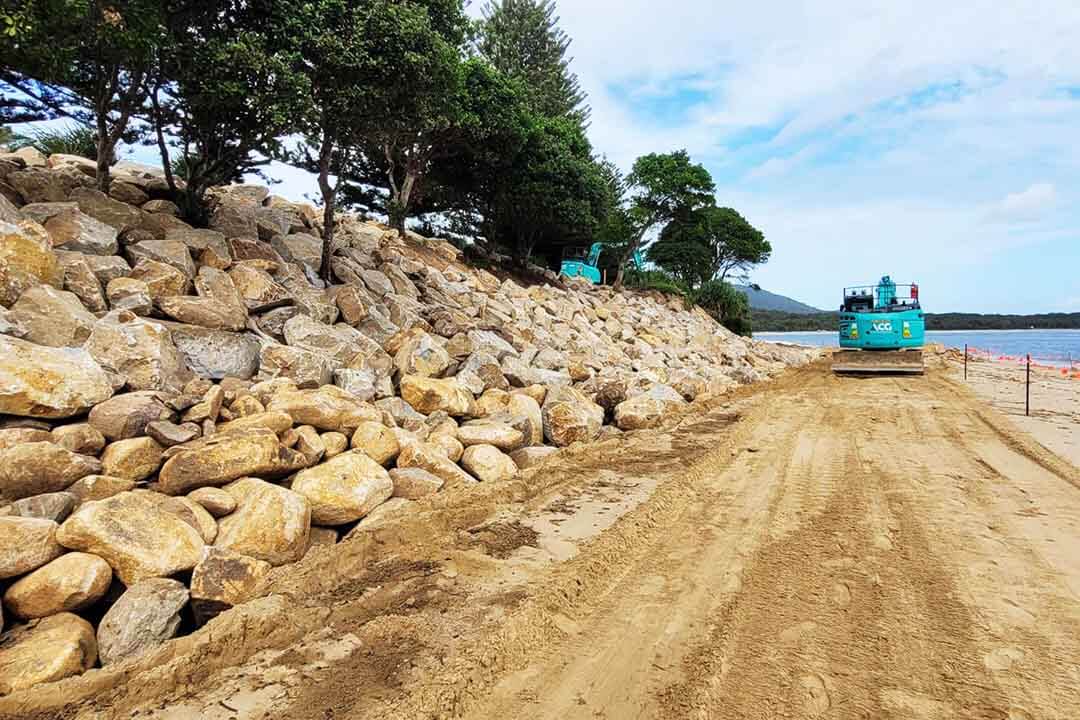 A sea wall made of boulders.