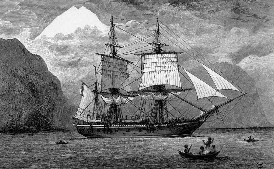 Black and white drawing of an old ship with large white sails on the ocean. In the foreground is a small boat with people in it.
