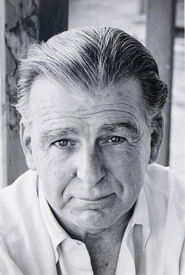 Black and white portrait photograph of an elderly man