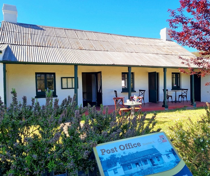Old post office building with verandah looking over the garden, Hartley Historic Site