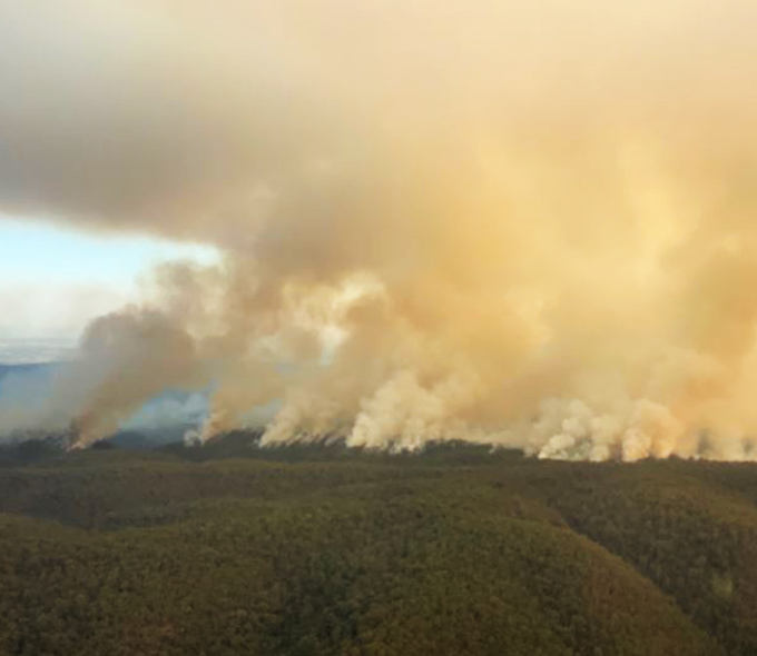 Thick smoke boiling up into the sky