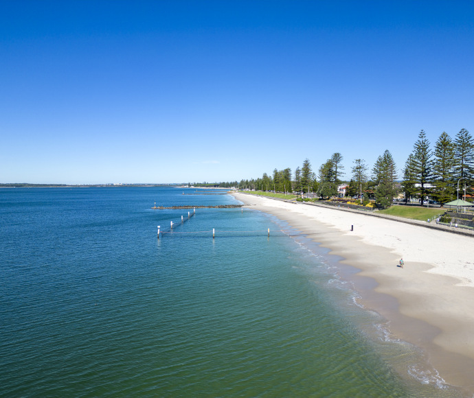 Looking along the long stretch of beach at Botany Bay, Sydney, which includes Monterey Baths
