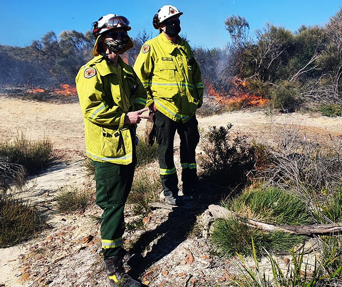 New firefighter, Zack Jeffries, learning from experienced NPWS firefighter Matt Summerhayes.