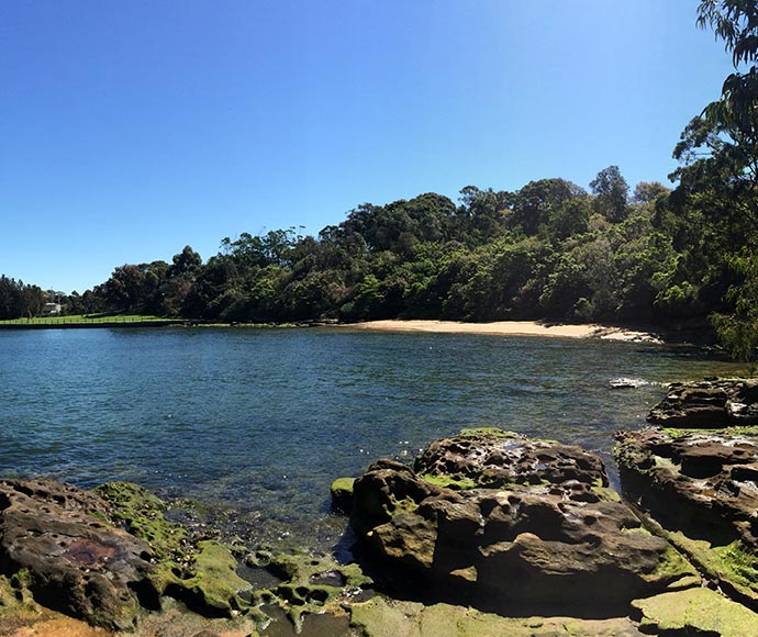 Bay with rocks in foreground.